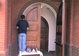 Commercial wood restoration of wooden entry door